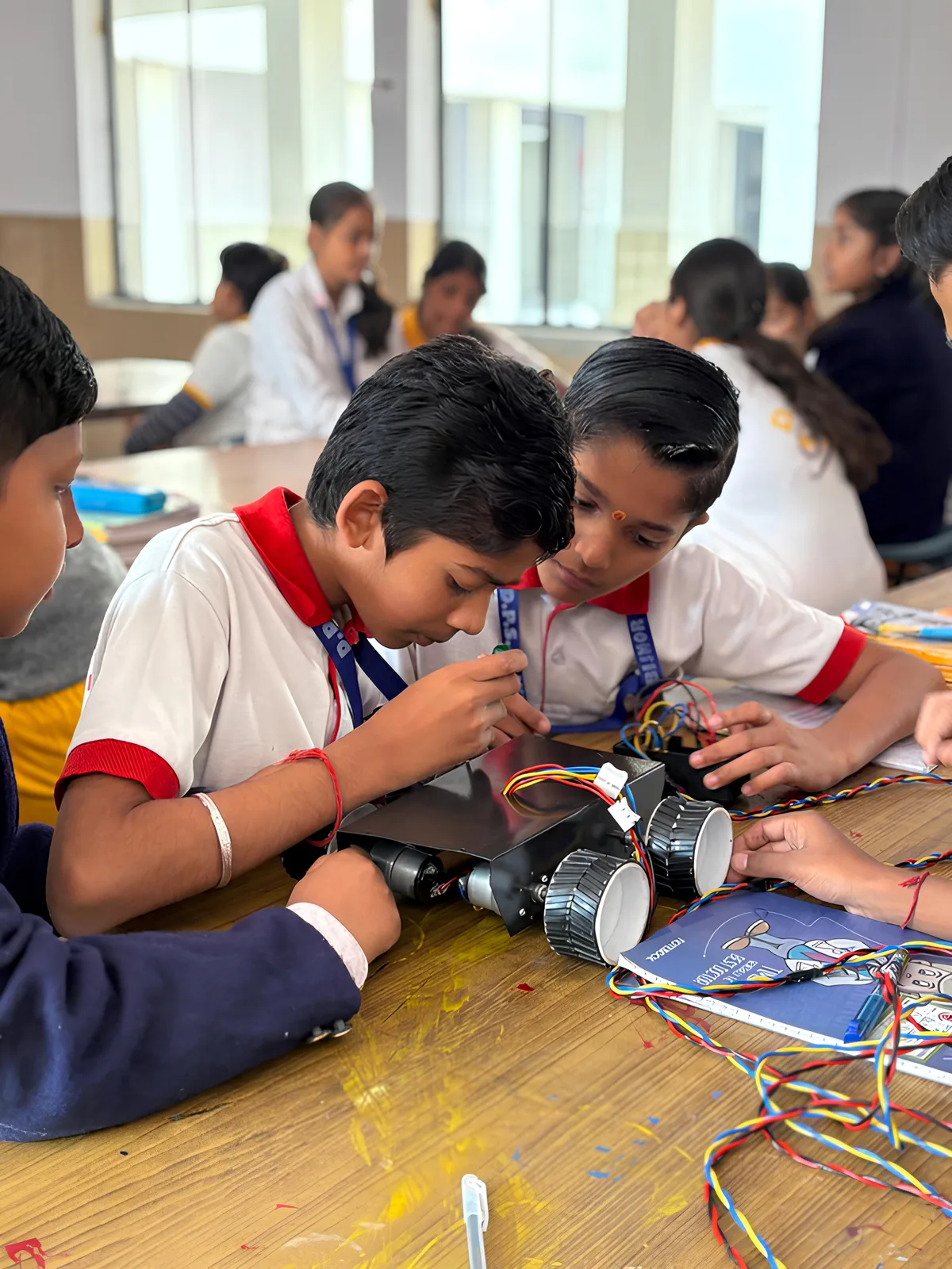 Students building hands-on robotics project